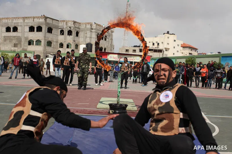 Palestinian students demonstrate their skills during a military-style show at a school in Rafah in the southern Gaza Strip March 28, 2016. Photo by Ashraf Amra