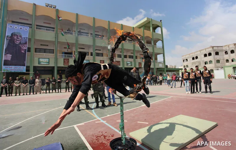 Palestinian students demonstrate their skills during a military-style show at a school in Rafah in the southern Gaza Strip March 28, 2016. Photo by Ashraf Amra