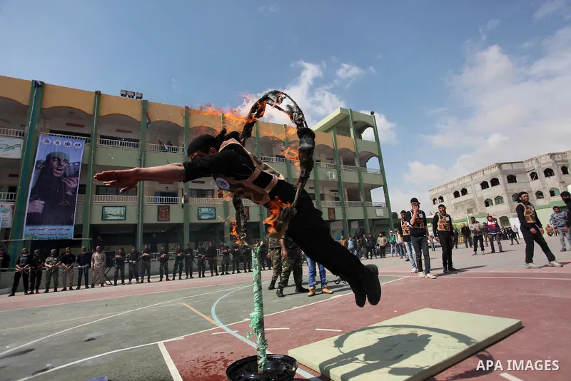 Palestinian students demonstrate their skills during a military-style show at a school in Rafah in the southern Gaza Strip March 28, 2016. Photo by Ashraf Amra