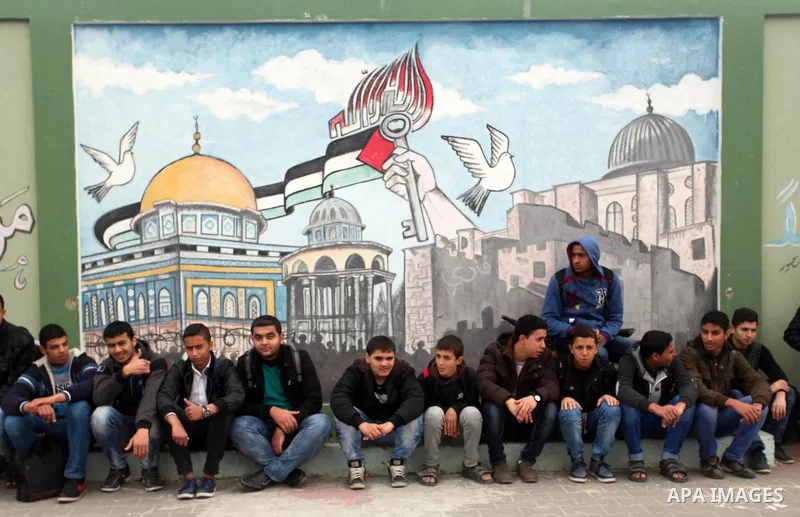 Palestinian students demonstrate their skills during a military-style show at a school in Rafah in the southern Gaza Strip March 28, 2016. Photo by Ashraf Amra