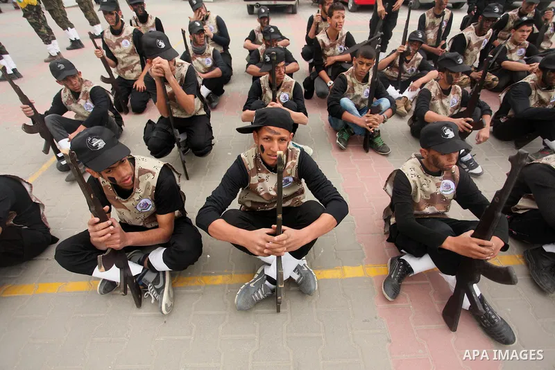 Palestinian students demonstrate their skills during a military-style show at a school in Rafah in the southern Gaza Strip March 28, 2016. Photo by Ashraf Amra