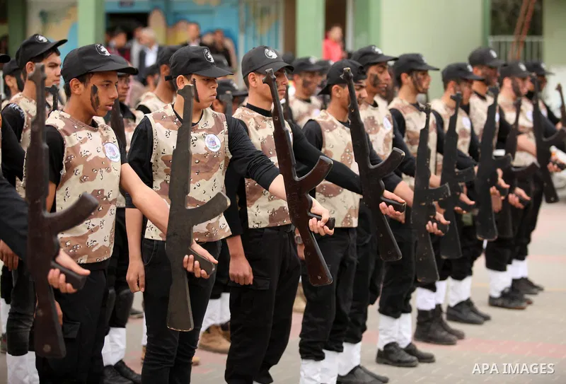 Palestinian students demonstrate their skills during a military-style show at a school in Rafah in the southern Gaza Strip March 28, 2016. Photo by Ashraf Amra