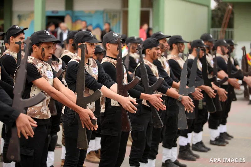 Palestinian students demonstrate their skills during a military-style show at a school in Rafah in the southern Gaza Strip March 28, 2016. Photo by Ashraf Amra