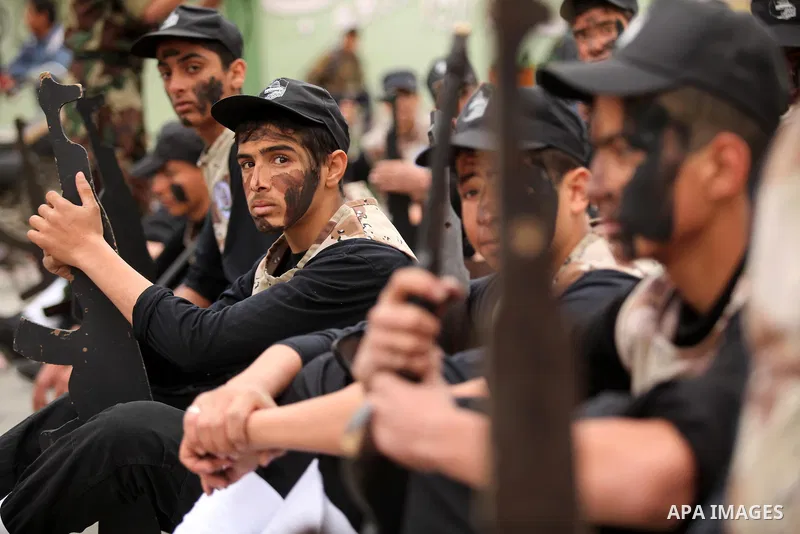 Palestinian students demonstrate their skills during a military-style show at a school in Rafah in the southern Gaza Strip March 28, 2016. Photo by Ashraf Amra