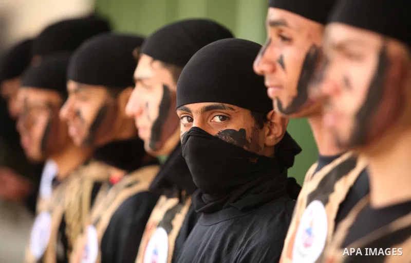 Palestinian students demonstrate their skills during a military-style show at a school in Rafah in the southern Gaza Strip March 28, 2016. Photo by Ashraf Amra