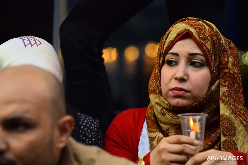 Egyptian journalists light candles during a protest the death of the Egyptian journalist Mayada Ashraf, outside the Egyptian Journalist Syndicate in Cairo, on March 28, 2016. Al-Dustour, a privately-owned newspaper, said...