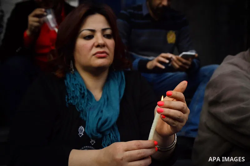 Egyptian journalists light candles during a protest the death of the Egyptian journalist Mayada Ashraf, outside the Egyptian Journalist Syndicate in Cairo, on March 28, 2016. Al-Dustour, a privately-owned newspaper, said...