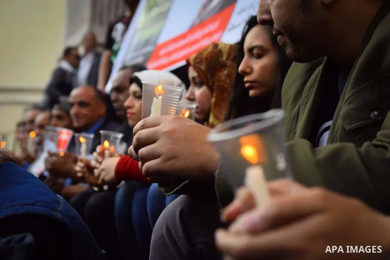 Egyptian journalists light candles during a protest the death of the Egyptian journalist Mayada Ashraf, outside the Egyptian Journalist Syndicate in Cairo, on March 28, 2016. Al-Dustour, a privately-owned newspaper, said...