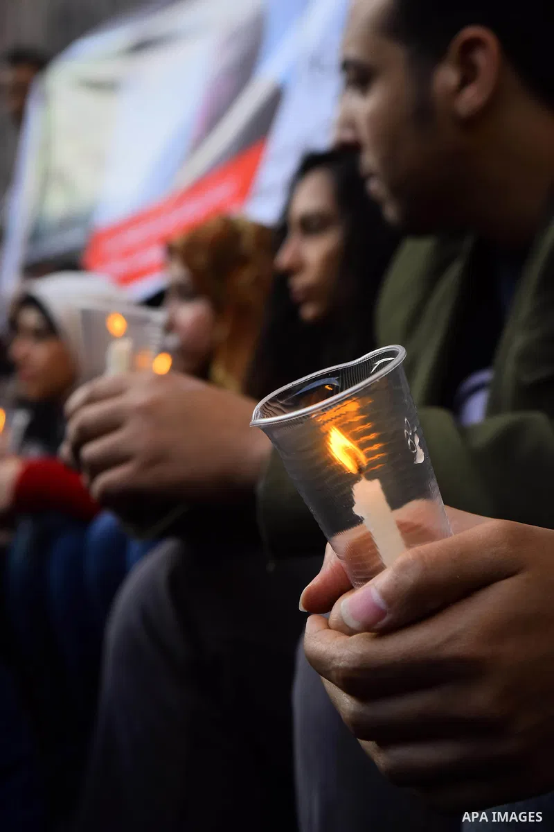 Egyptian journalists light candles during a protest the death of the Egyptian journalist Mayada Ashraf, outside the Egyptian Journalist Syndicate in Cairo, on March 28, 2016. Al-Dustour, a privately-owned newspaper, said...