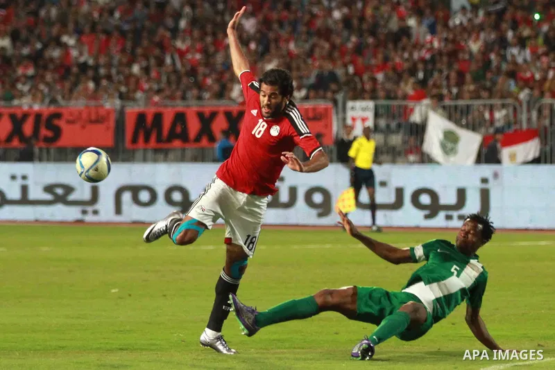 Egyptian players and Nigerian players compete during their African Cup of Nations group G qualification football match between Egypt and Nigeria at the Borg el-Arab Stadium in Alexandria on March 29, 2016. Photo by Strin...
