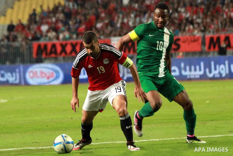 Egyptian players and Nigerian players compete during their African Cup of Nations group G qualification football match between Egypt and Nigeria at the Borg el-Arab Stadium in Alexandria on March 29, 2016. Photo by Strin...