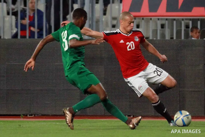 Egyptian players and Nigerian players compete during their African Cup of Nations group G qualification football match between Egypt and Nigeria at the Borg el-Arab Stadium in Alexandria on March 29, 2016. Photo by Strin...