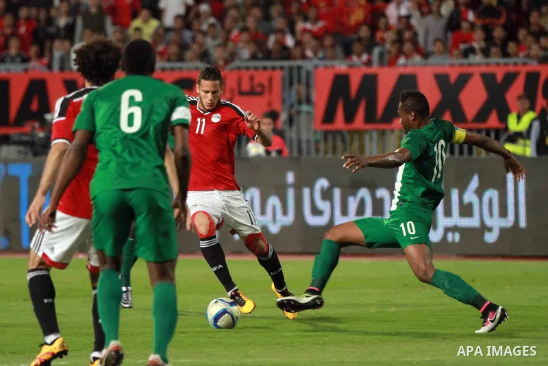 Egyptian players and Nigerian players compete during their African Cup of Nations group G qualification football match between Egypt and Nigeria at the Borg el-Arab Stadium in Alexandria on March 29, 2016. Photo by Strin...