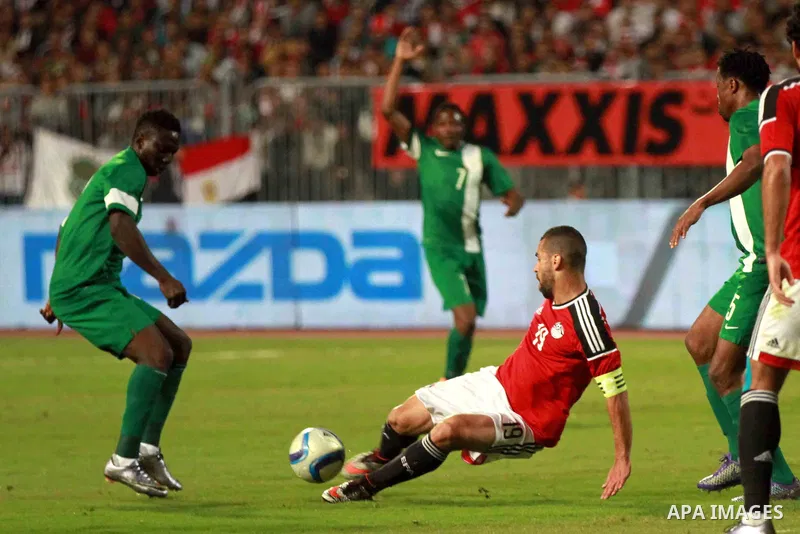 Egyptian players and Nigerian players compete during their African Cup of Nations group G qualification football match between Egypt and Nigeria at the Borg el-Arab Stadium in Alexandria on March 29, 2016. Photo by Strin...