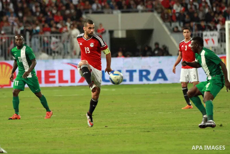 Egyptian players and Nigerian players compete during their African Cup of Nations group G qualification football match between Egypt and Nigeria at the Borg el-Arab Stadium in Alexandria on March 29, 2016. Photo by Strin...