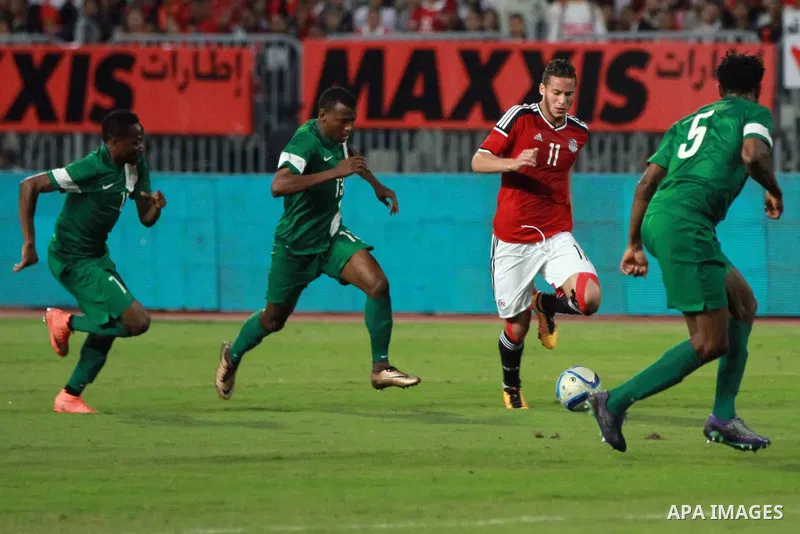 Egyptian players and Nigerian players compete during their African Cup of Nations group G qualification football match between Egypt and Nigeria at the Borg el-Arab Stadium in Alexandria on March 29, 2016. Photo by Strin...