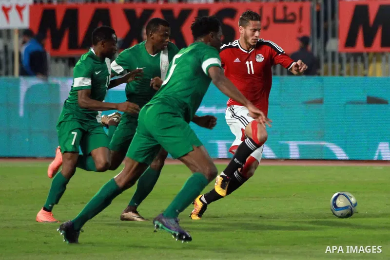 Egyptian players and Nigerian players compete during their African Cup of Nations group G qualification football match between Egypt and Nigeria at the Borg el-Arab Stadium in Alexandria on March 29, 2016. Photo by Strin...