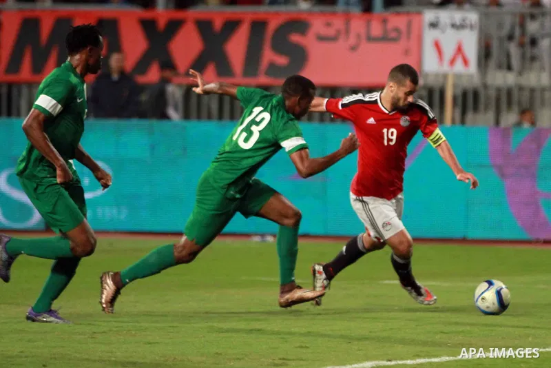 Egyptian players and Nigerian players compete during their African Cup of Nations group G qualification football match between Egypt and Nigeria at the Borg el-Arab Stadium in Alexandria on March 29, 2016. Photo by Strin...