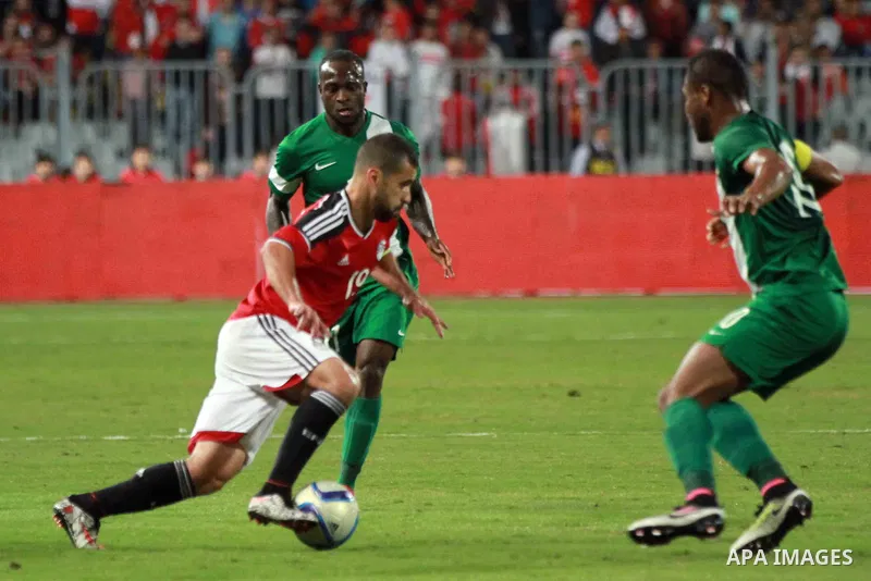 Egyptian players and Nigerian players compete during their African Cup of Nations group G qualification football match between Egypt and Nigeria at the Borg el-Arab Stadium in Alexandria on March 29, 2016. Photo by Strin...