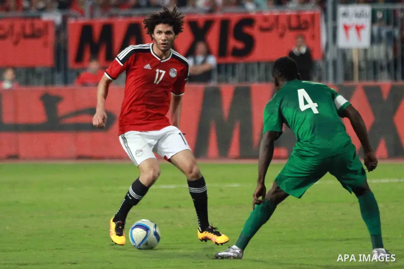 Egyptian players and Nigerian players compete during their African Cup of Nations group G qualification football match between Egypt and Nigeria at the Borg el-Arab Stadium in Alexandria on March 29, 2016. Photo by Strin...