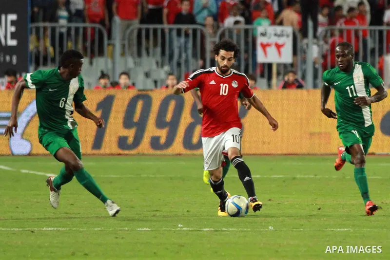 Egyptian players and Nigerian players compete during their African Cup of Nations group G qualification football match between Egypt and Nigeria at the Borg el-Arab Stadium in Alexandria on March 29, 2016. Photo by Strin...