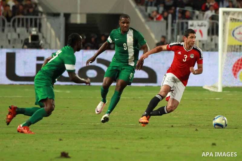 Egyptian players and Nigerian players compete during their African Cup of Nations group G qualification football match between Egypt and Nigeria at the Borg el-Arab Stadium in Alexandria on March 29, 2016. Photo by Strin...