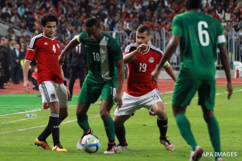 Egyptian players and Nigerian players compete during their African Cup of Nations group G qualification football match between Egypt and Nigeria at the Borg el-Arab Stadium in Alexandria on March 29, 2016. Photo by Strin...
