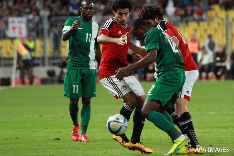 Egyptian players and Nigerian players compete during their African Cup of Nations group G qualification football match between Egypt and Nigeria at the Borg el-Arab Stadium in Alexandria on March 29, 2016. Photo by Strin...