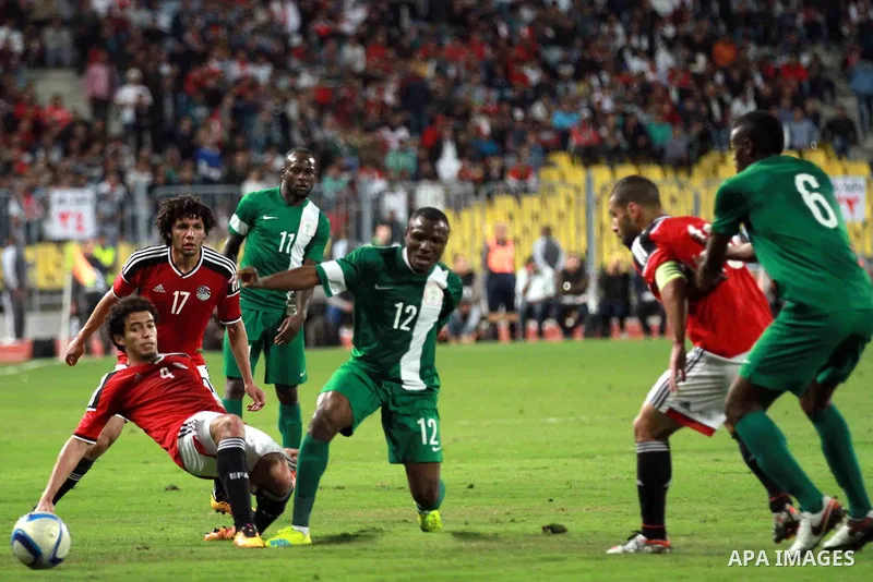 Egyptian players and Nigerian players compete during their African Cup of Nations group G qualification football match between Egypt and Nigeria at the Borg el-Arab Stadium in Alexandria on March 29, 2016. Photo by Strin...