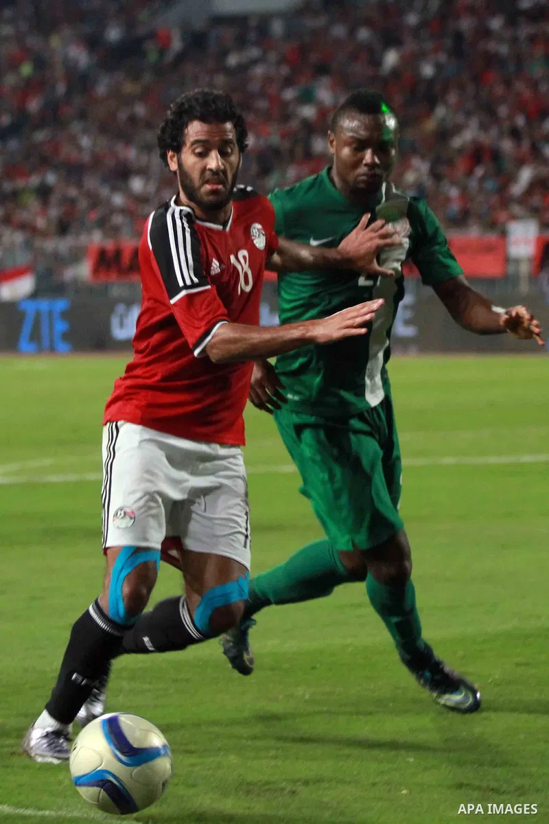Egyptian players and Nigerian players compete during their African Cup of Nations group G qualification football match between Egypt and Nigeria at the Borg el-Arab Stadium in Alexandria on March 29, 2016. Photo by Strin...
