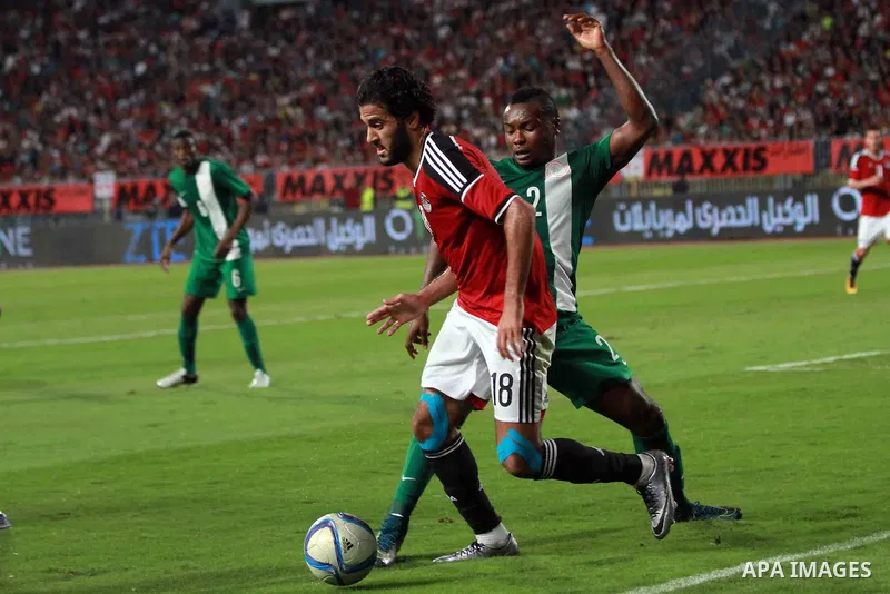 Egyptian players and Nigerian players compete during their African Cup of Nations group G qualification football match between Egypt and Nigeria at the Borg el-Arab Stadium in Alexandria on March 29, 2016. Photo by Strin...