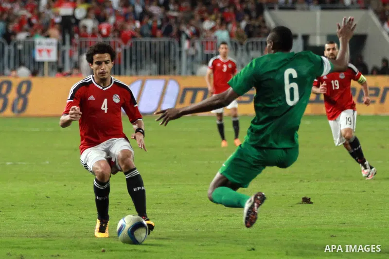 Egyptian players and Nigerian players compete during their African Cup of Nations group G qualification football match between Egypt and Nigeria at the Borg el-Arab Stadium in Alexandria on March 29, 2016. Photo by Strin...