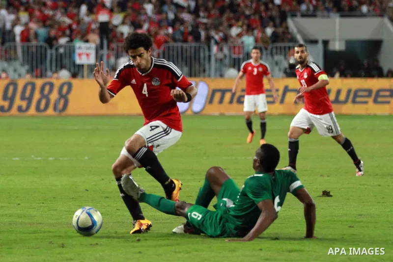 Egyptian players and Nigerian players compete during their African Cup of Nations group G qualification football match between Egypt and Nigeria at the Borg el-Arab Stadium in Alexandria on March 29, 2016. Photo by Strin...