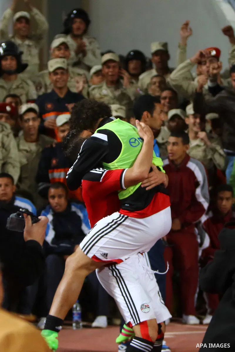 Egyptian players and Nigerian players compete during their African Cup of Nations group G qualification football match between Egypt and Nigeria at the Borg el-Arab Stadium in Alexandria on March 29, 2016. Photo by Strin...