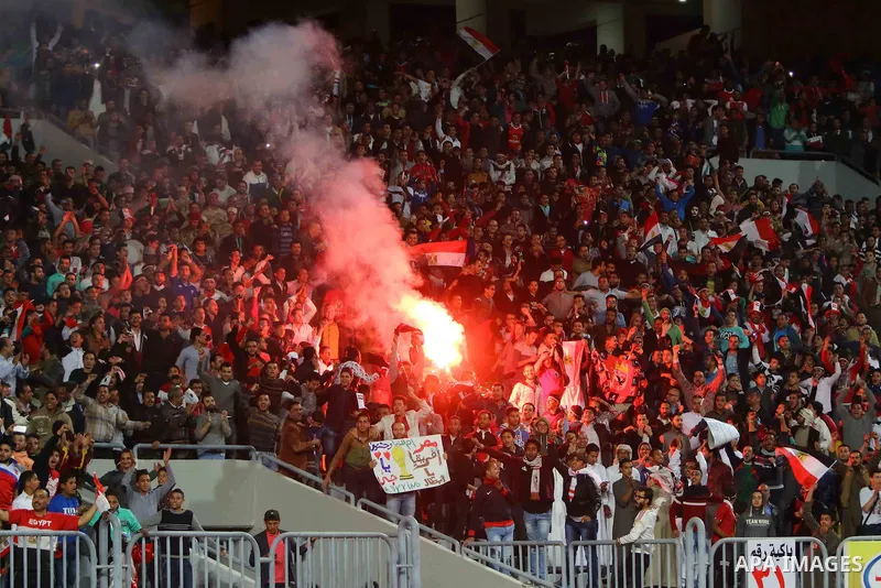 Egyptian fans watch the African Cup of Nations group G qualification football match between Egypt and Nigeria at the Borg el-Arab Stadium in Alexandria on March 29, 2016. Photo by Stringer