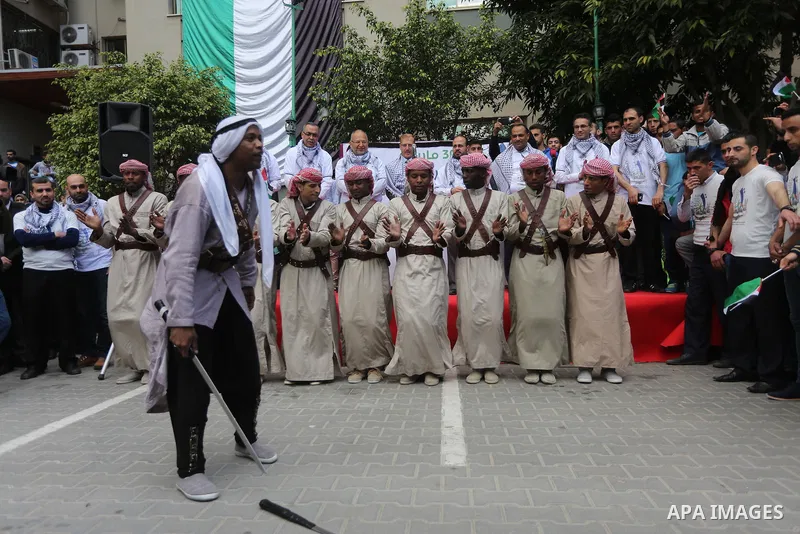 Palestinians take part in a rally marking Land Day, in Gaza City March 30, 2016. March 30 marks Land Day, the annual commemorations of the killing by police of six Arab citizens in 1976 during protests against land confi...