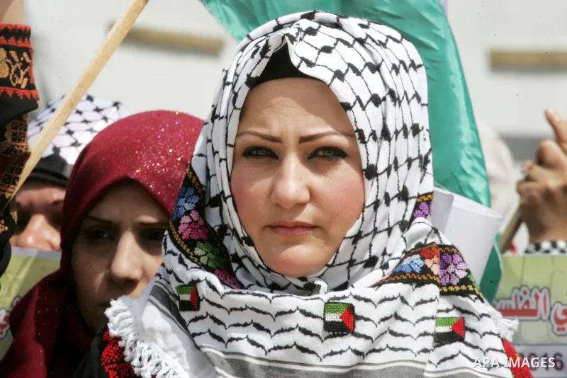 Palestinian women take part in a protest to mark Land Day on March 30, 2016, in Khan Yunis, in the southern Gaza Strip. March 30 marks Land Day, the annual commemorations of the killing by police of six Arab citizens in...