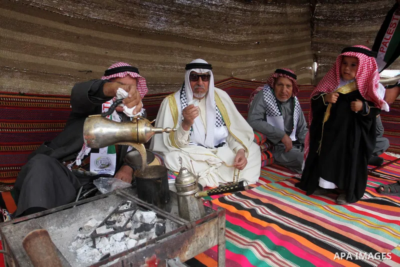 Palestinian men gather in a tent to mark Land Day on March 30, 2016, in Khan Yunis, in the southern Gaza Strip, as Palestinians mark Land Day. March 30 marks Land Day, the annual commemorations of the killing by police o...