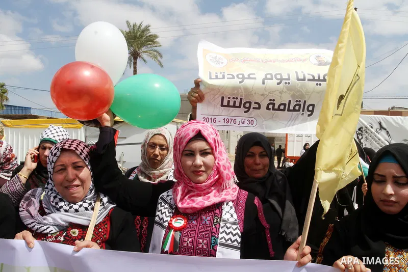 Palestinian women take part in a protest to mark Land Day on March 30, 2016, in Khan Yunis, in the southern Gaza Strip. March 30 marks Land Day, the annual commemorations of the killing by police of six Arab citizens in...
