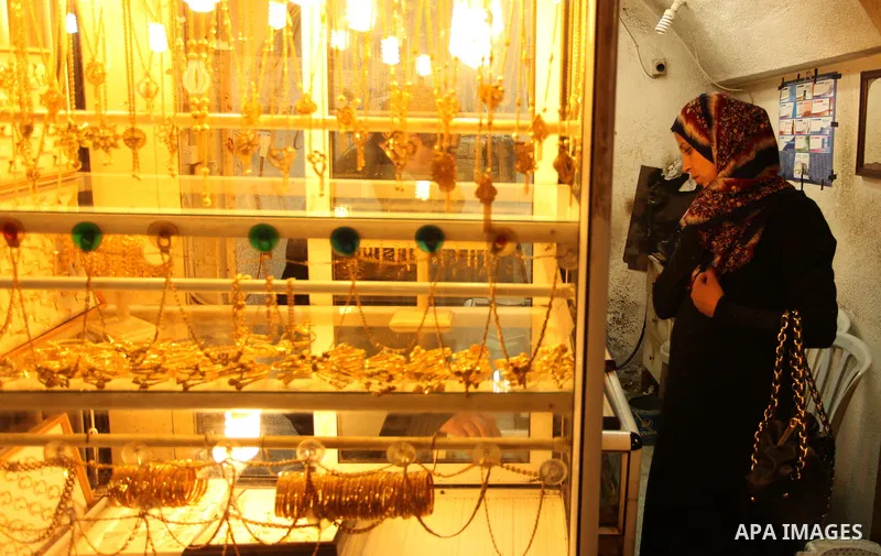 A Palestinian woman sits inside a jewellery store in Gaza city on March 30, 2016. The director of the Palestinian Authority’s borders and crossings department, Nathmi Muhanna said that Israeli authorities notified his de...