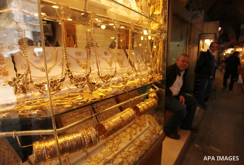A Palestinian man sits outside his jewellery store in Gaza city on March 30, 2016. The director of the Palestinian Authority’s borders and crossings department, Nathmi Muhanna said that Israeli authorities notified his d...