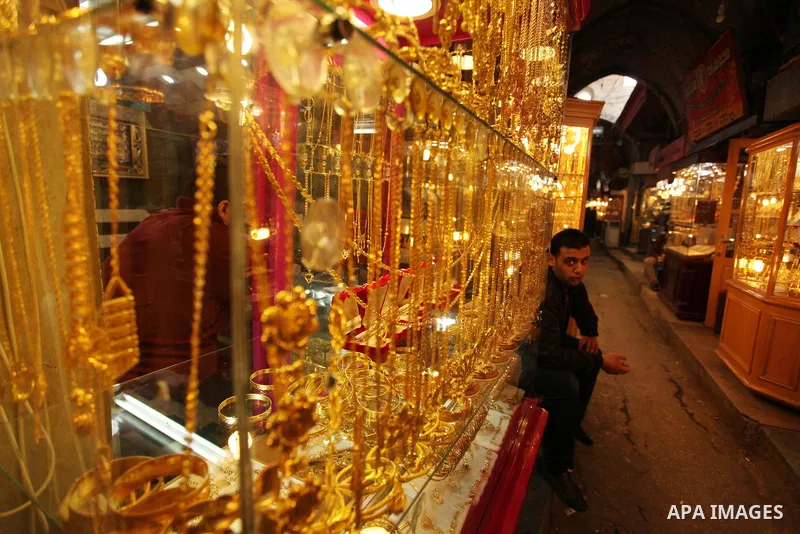A Palestinian man sits outside his jewellery store in Gaza city on March 30, 2016. The director of the Palestinian Authority’s borders and crossings department, Nathmi Muhanna said that Israeli authorities notified his d...