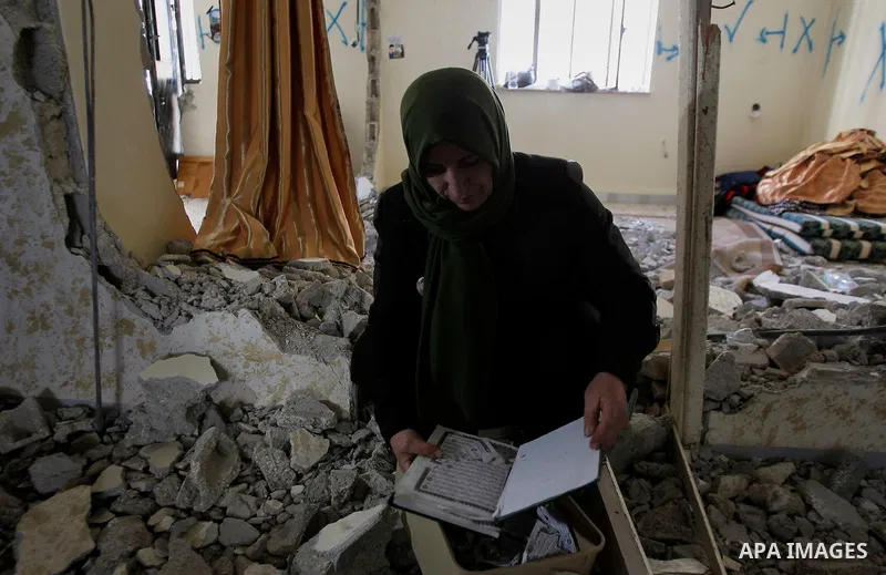 Palestinians check the damage house of Ihab Maswada that was demolished by the Israeli army in the West Bank city of Hebron March 31, 2016. Ihab Maswada was killed on Dec. 7 after carrying out a stabbing attack against a...