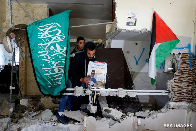 Palestinians check the damage house of Ihab Maswada that was demolished by the Israeli army in the West Bank city of Hebron March 31, 2016. Ihab Maswada was killed on Dec. 7 after carrying out a stabbing attack against a...