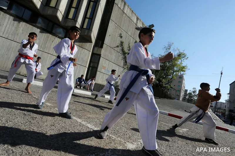 Palestinians perform Karate during a cultural carnival organized by Gaza Municipality in Gaza City April 1, 2016. Photo by Mohammed Asad