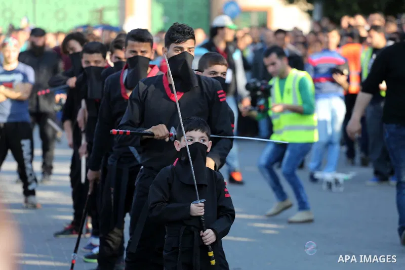 Palestinians participate in a cultural carnival organized by Gaza Municipality in Gaza City April 1, 2016. Photo by Mohammed Asad