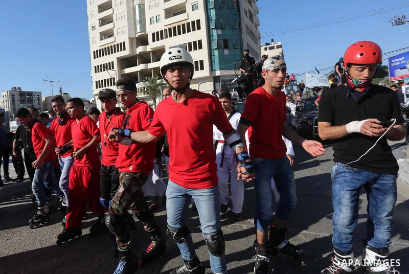 Palestinians participate in a cultural carnival organized by Gaza Municipality in Gaza City April 1, 2016. Photo by Mohammed Asad