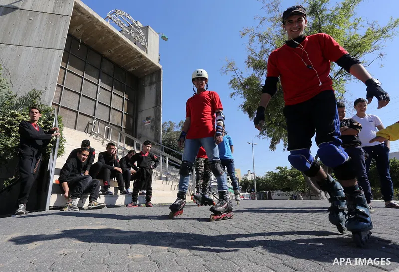 A Palestinian performs stunts during a cultural carnival organized by Gaza Municipality in Gaza City April 1, 2016. Photo by Mohammed Asad