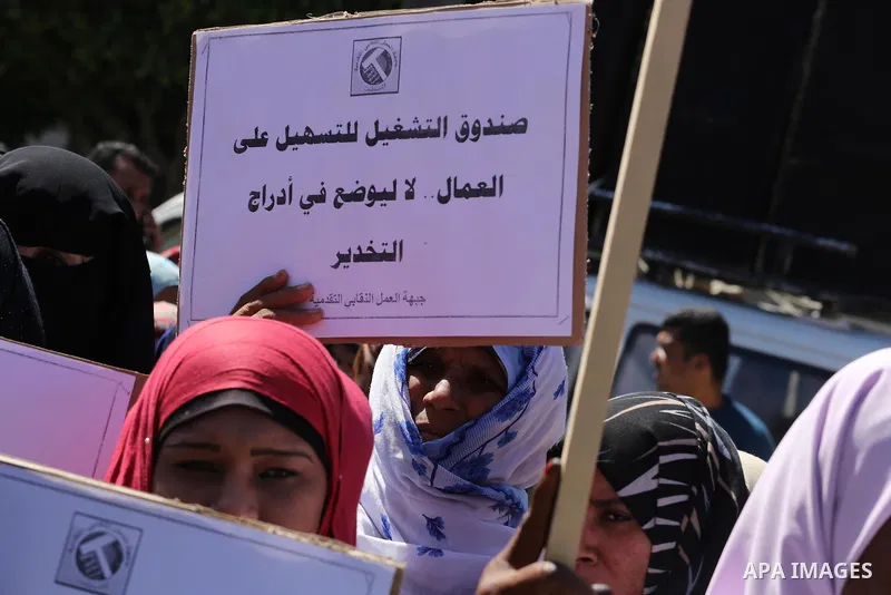 Palestinian supporters of Popular front for Liberation of Palestine (PFLP) hold banners during a protest against the siege of Gaza, in Gaza City, on April 2, 2016. Photo by Mohammed Asad