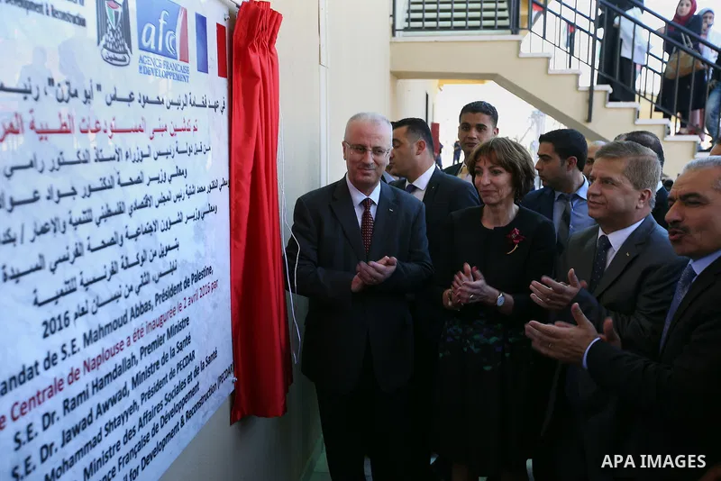 Palestinian Prime Minister, Rami Hamdallah, attends the inauguration ceremony of the Central Medical Stores, funded by the French Development Agency, in the West Bank city of Nablus, on April 2, 2016. Photo by Prime Mini...